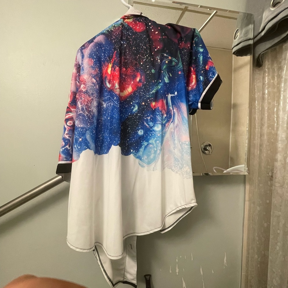 A button up multicoloured short sleeve shirt.
